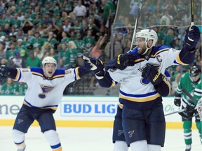DALLAS, TX - MAY 01:  David Backes #42 of the St. Louis Blues and Vladimir Tarasenko #91 of the St. Louis Blues celebrate after Backes scored the game winning goal against Antti Niemi #31 of the Dallas Stars in overtime in Game Two of the Western Conference Second Round during the 2016 NHL Stanley Cup Playoffs at American Airlines Center on May 1, 2016 in Dallas, Texas.