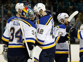 David Backes #42 celebrates with Jake Allen #34 of the St. Louis Blues after their 6-3 win in game four over the San Jose Sharks in the Western Conference Finals.