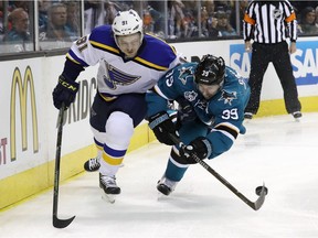 Vladimir Tarasenko, left, has been pretty much squeezed out of the Western Conference Final picture by the San Jose Sharks. Logan Couture keeps the St. Louis Blues' sniper to the outside on this rush earlier in the best-of-seven playoff series.