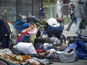 A May 16 photo shows people living on 135A Street in the Whalley area of Surrey. Mark van Manen/PNG files