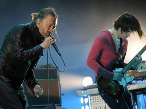 FILE - In this April 14, 2012 file photo, Thom Yorke, left, and Jonny Greenwood of Radiohead perform during the band's headlining set at the 2012 Coachella Valley Music and Arts Festival in Indio, Calif.