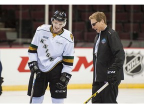 Matthew Tkachuck of the shares a laugh with assistant coach Glen Hanlon before the Top Prospects Game at the Pacific Coliseum in January. Richard Lam/PNG files