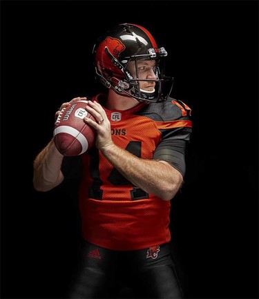 Quarterback Travis Lulay models the B.C. Lions’ new adidas-produced home jersey and helmet for the 2016 CFL season, part of a league-wide revamp of team uniforms.