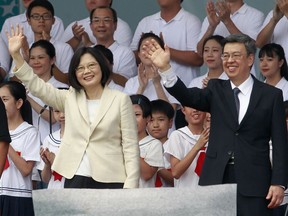 Taiwan's new president, Tsai Ing-wen (left), and vice-president Chen Chien-jen wave during their inauguration ceremonies in Taipei on May 20.