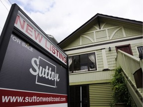 VANCOUVER, B.C.: AUGUST 08, 2012 --    Real estate signs adorn houses and condos sold and for sale in Vancouver, Wednesday, August 8, 2012.  ( Gerry Kahrmann /  PNG staff photo) ( For Sun News) [PNG Merlin Archive] ORG XMIT: POS2013011514534953