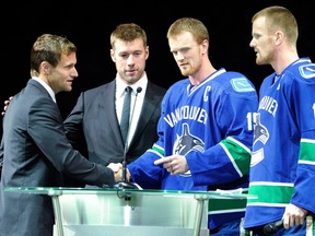 Swede reunion: From left, Markus Naslund, Mattias Ohlund, Henrik and Daniel Sedin at Naslund's jersey retirement ceremony in 2010. It's expected Ohlund will be the next Canuck recognized, joining the Ring of Honour.
