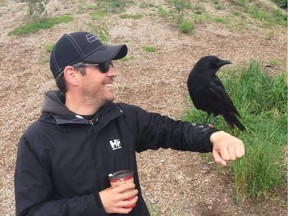 Vancouver resident Shawn Bergman is pictured here with Canuck the crow on his arm. Canuck was rescued and raised by Bergman's landlord and when he was released, imprinted on Bergman and continues to visit him occasionally to this day.