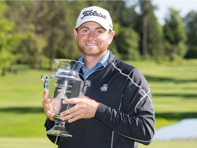 Freedom 55 Financial Open champion Dan McCarthy of Syracuse, N.Y., poses with the trophy at the Point Grey Golf & Country Club in Vancouver on Sunday. Chuck Russell/PGA TOUR