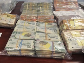 RCMP display money seized during investigation into Van Kalkeren and Hells Angels in 2012