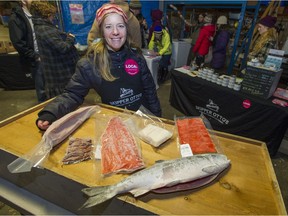 Sonia Strobel displays fish that is available through Skipper Otto's community-supported fishery program.