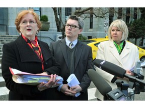 NPA councillors Elizabeth Ball (left), George Affleck and Green party Councillor Adriane Carr walked out of a public hearing Tuesday night. The councillors — shown outside City Hall in this 2012 photo — say they left to protest their treatment by Vision Vancouver Coun. Raymond Louie.