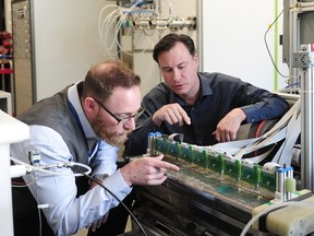 Loops Energy's chief scientist Sean MacKinnon (left) with Rob Wingrove, director of product development in their lab at the National Research Council of Canada facility on the UBC campus.