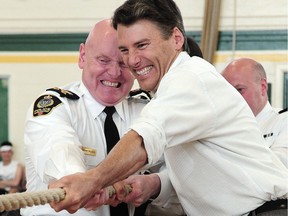 VANCOUVER, BC., May 10, 2016 -- Vancouver Mayor Gregor Robertson joins Chief Constable Adam Palmer  and the Vancouver Police Department in a tug-of-war competition to kick-off Inner City Kids Week at Vancouver Technical Secondary School, in Vancouver, BC., May 10, 2016.  (Nick Procaylo/PNG)   00043132A   [PNG Merlin Archive]