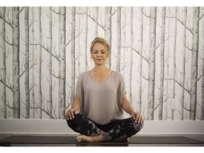 Michele Kambolis meditating at her Vancouver home.