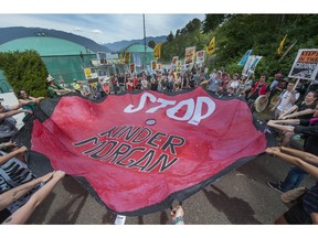 Activists surrounded the Kinder Morgan marine terminal in Burnaby earlier this summer.