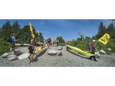 Kayakers prepare to cross Burrard Inlet from Cate's Park in North Vancouver as climate change activists surrounded the Kinder Morgan marine terminal  on land and water in Burnaby, BC. May 14, 2016.