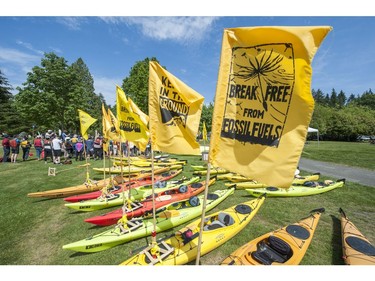 Kayakers prepare to cross Burrard Inlet from Cate's Park in North Vancouver as climate change activists surrounded the Kinder Morgan marine terminal  on land and water in Burnaby, BC. May 14, 2016.