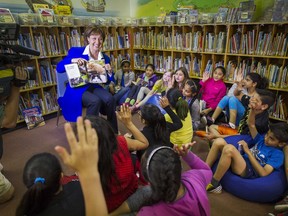 B.C. Premier Christy Clark leads story time at Panorama Park Elementary School in Surrey, where she announced an expansion of 2,700 school places in the city.