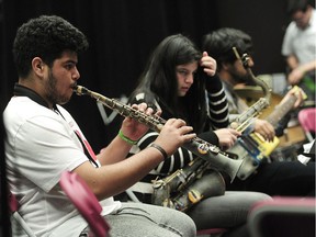 Members of the Recycled Orchestra of Paraguay with recycled instruments during a rehearsal at Vancouver College before their concert at UBC on Monday night, in Vancouver.
