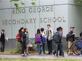 Students at King George Secondary leave school Thursday afternoon. The provincial government has announced they are scrapping provincial exams next school year.