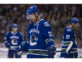 VANCOUVER February 04 2016. Vancouver Canucks #33 Henrik Sedin and #22 Daniel Sedin prepare for a face off against the Columbus Blue Jackets in the first period of a regular season NHL hockey game at Rogers arena, Vancouver, February 04 2016.  Gerry Kahrmann  /  PNG staff photo) / PNG staff photo) ( For Prov / Sun News ) 00041576A  [PNG Merlin Archive]