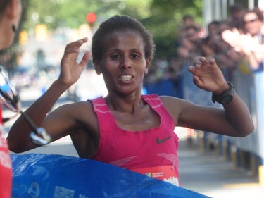 Hirut Guangul crosses the finish line in first place for women in the BMO Vancouver marathon in Vancouver, BC., May 1, 2016.