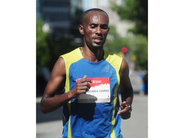Habteselassa Lemma Gemechu crosses the finish line in second place in the BMO Vancouver marathon in Vancouver, BC., May 1, 2016.