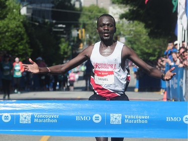 Daniel Kipkoech crosses the finish line in first place in the BMO Vancouver Marathon in Vancouver, BC., May 1, 2016.