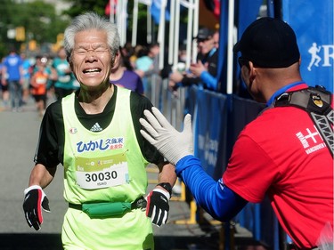 Marathon runners in action during the BMO Vancouver marathon in Vancouver, BC., May 1, 2016.