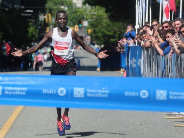 Daniel Kipkoech crosses the finish line in first place in the BMO Vancouver marathon in Vancouver, BC., May 1, 2016.