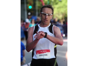 Graeme Wilson crosses the finish line in fourth place in the BMO Vancouver marathon in Vancouver, BC., May 1, 2016.