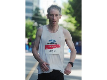 Oliver Utting crosses the finish line in fifth place in the BMO Vancouver marathon in Vancouver, BC., May 1, 2016.