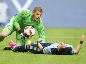 Chicago Fire goalkeeper Matt Lampson looks worried after colliding with Vancouver Whitecaps striker Masato Kudo during during Wednesday’s Major League Soccer game at B.C. Place Stadium. Kudo suffered a broken jaw.