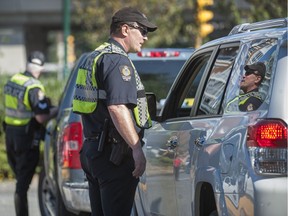 FILE PHOTO: A  police campaign against distracted driving in Vancouver.