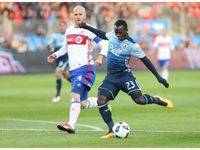 Vancouver Whitecaps forward Kekuta Manneh takes a kick that beats Toronto FC goalkeeper Clint Irwin during the first half of their Major League Soccer match in Toronto on Saturday. Manneh was named MLS player of the week on Tuesday, largely for his two-goal, one-assist effort against TFC in the Caps' 4-3 victory.