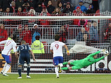 Vancouver Whitecaps goalkeeper David Ousted (1) makes a save on a penalty kick by Toronto FC forward Jozy Altidore (17) during the first half of MLS action in Toronto on Saturday, May 14, 2016.