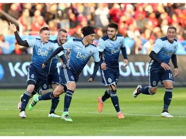 Vancouver Whitecaps midfielder Christian Bolanos (7) celebrates his goal against Toronto FC during the first half of MLS action in Toronto on Saturday, May 14, 2016.