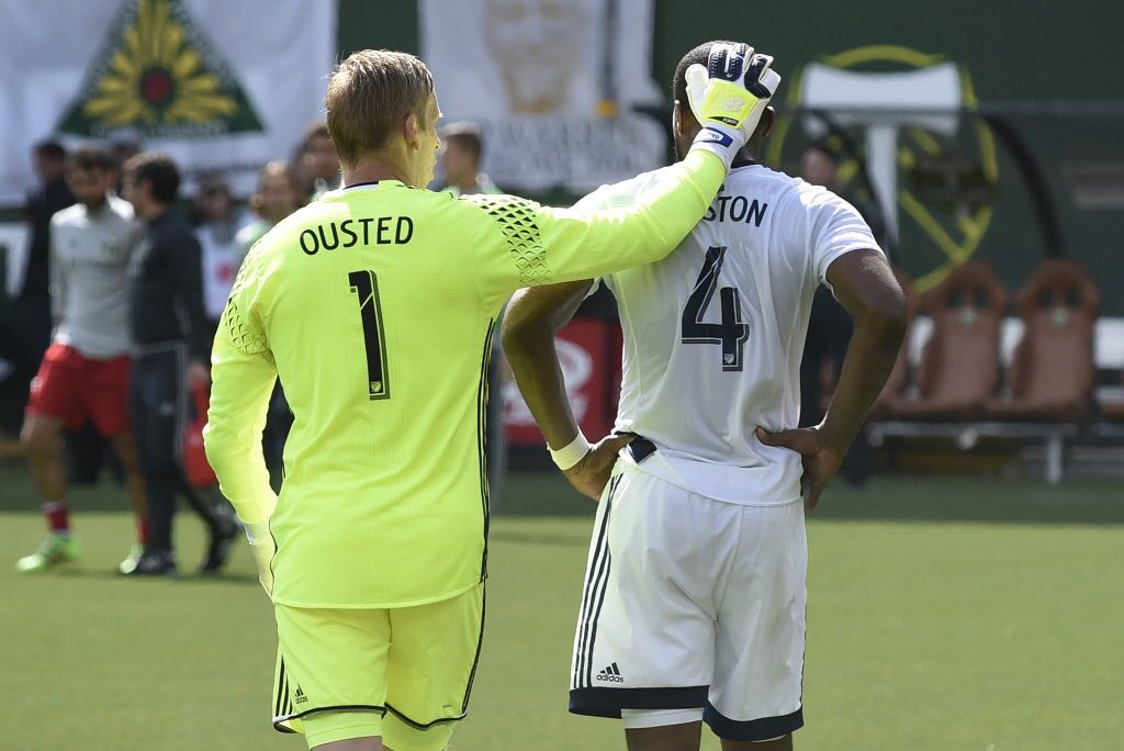 Vancouver Whitecaps goalkeeper David Ousted (1) consoles teammate defender Kendall Watson (4) after Watson received a red card.
