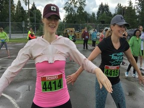 Paula Paulsen, right, and Jodi Geret were all smiles on Sunday taking part in the zumba warm-up, before finishing one-two in the women's 10K at the 19th annual Vistas Run for Hospice at Kanaka Creek Regional Park in Maple Ridge.