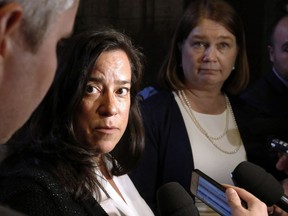 Minister of Justice Jody Wilson-Raybould and Health Minister Jane Philpott, right, talk to reporters on Tuesday after the federal government's controversial bill on assisted dying sailed through the House of Commons, approved by a vote of 186-137.