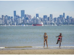 Julia Nelson, left and Cynthia Ouchi, right play on Spanish Banks beach in Vancouver , B.C. Sunday June 5, 2016. Sunday wasn’t just a hot day; it was a day of record-breaking high temperatures for 16 communities across B.C.