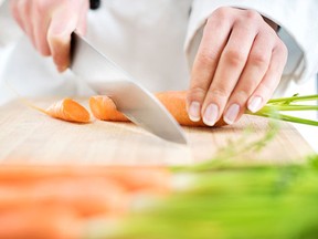 Cutting carrots.