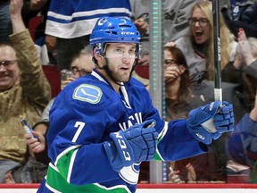 VANCOUVER, BC - MARCH 1:  Linden Vey #7 of the Vancouver Canucks celebrates after scoring against the New York Islanders during their NHL game at Rogers Arena March 1, 2016 in Vancouver, British Columbia, Canada.  (Photo by Jeff Vinnick/NHLI via Getty Images) ORG XMIT: 574715071 [PNG Merlin Archive]