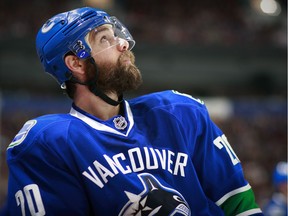 VANCOUVER, BC - APRIL 6:  Chris Higgins #20 of the Vancouver Canucks looks on from the bench during their NHL game against the Los Angeles Kings at Rogers Arena April 6, 2015 in Vancouver, British Columbia, Canada.  (Photo by Jeff Vinnick/NHLI via Getty Images) [PNG Merlin Archive]