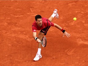 Novak Djokovic of Serbia hits a forehand during the Men's Singles final match against Andy Murray of Great Britain on day fifteen of the 2016 French Open at Roland Garros on June 5, 2016 in Paris, France.