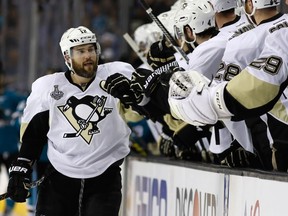 Ben Lovejoy of the Pittsburgh Penguins celebrates his goal with his team during the first period against the San Jose Sharks in Game Three of the 2016 NHL Stanley Cup Final at SAP Center on Saturday. The Sharks won 3-2 in overtime and now trail the Penguins 2-1 going into Game 4 on Monday.