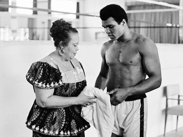 TO GO WITH AFP STORIES In this photo taken on October 27, 1974 US boxing heavyweight champion Muhammad Ali (born Cassius Clay) stands with her mother Odetta Lee Clay during a training session three days before the heavy weight world championship in Kinshasa. On October 30, 1974 Muhammad Ali knocked out George Foreman in a clash of titans known as the "Rumble in the Jungle", watched by 60 000 people in the stadium in Kinshasa and millions elsewhere. AFP PHOTO-/AFP/Getty Images ORG XMIT: POS2016060317075252      Muhammad Ali options ORG XMIT: POS1606031709080297
