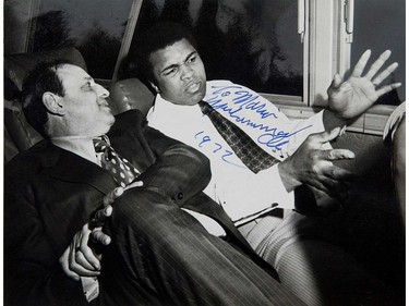 Items of memorabilia from a 1972 exhibition fight between Muhammad Ali  and George Chuvalo held at the Pacific coliseum. This is an autographed photo of former PNE Forum manager Mario Caravetta, left, with Ali.