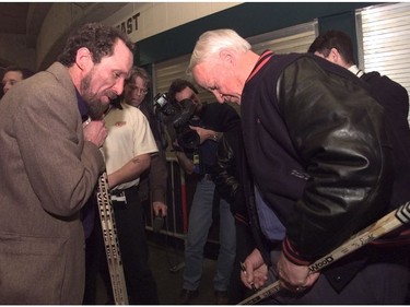 Art Dahlo gets hockey legend Gordie Howe to sign a hockey stick. Dahlo sharpened Howes' skates on Nov. 17, 1970 which was the only game that Howe played here in Vancouver as a Detroit Red Wing.