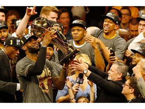 Cleveland Cavaliers forward LeBron James hoists the Larry O'Brien trophy after defeating the Golden State Warriors to win the NBA Finals on June 19, 2016 in Oakland, California. Powered by an amazing effort from LeBron James, the Cleveland Cavaliers completed the greatest comeback in NBA Finals history, dethroning defending champion Golden State 93-89 to capture their first NBA title. The Cavaliers won the best-of-seven series 4-3 to claim the first league crown in their 46-season history and deliver the first major sports champion to Cleveland since the 1964 NFL Browns, ending the longest such title drought for any American city.  /